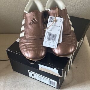 adidas Women’s 6 Metallic Rose Gold Sneakers with White Stripes